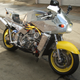 Illustration for article titled A Wonderful Crazy Genius Crammed A Ferrari V8 Into A Custom Motorcycle